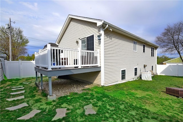 1 Augusta St, Providence, RI 02908 - exterior space featuring a fenced backyard, a lawn, and a deck