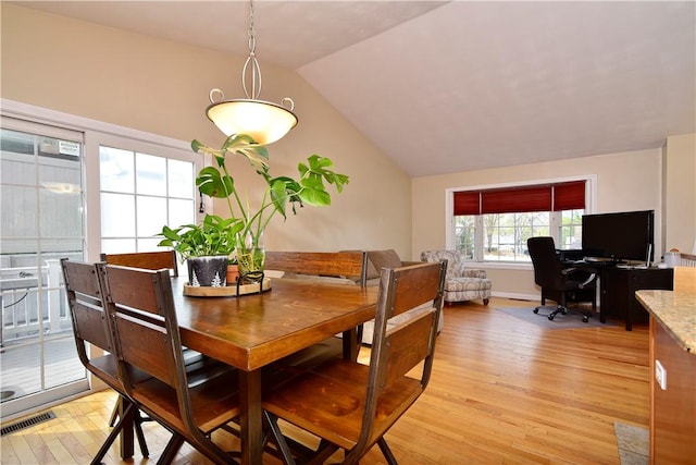 1 Augusta St, Providence, RI 02908 - dining area with visible vents, lofted ceiling, and light wood-type flooring