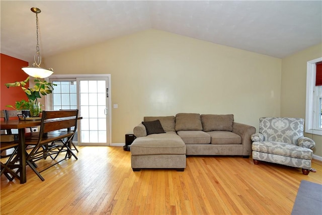 1 Augusta St, Providence, RI 02908 - living room featuring baseboards, light wood finished floors, and lofted ceiling