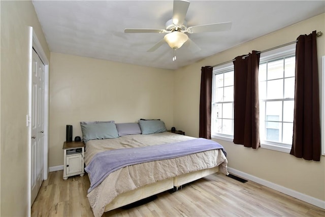 1 Augusta St, Providence, RI 02908 - bedroom featuring baseboards, multiple windows, and light wood-style flooring