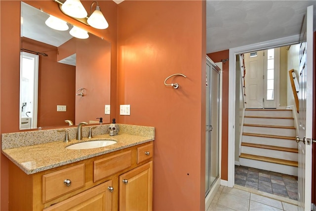 1 Augusta St, Providence, RI 02908 - full bathroom with vanity, baseboards, tile patterned flooring, and a shower stall