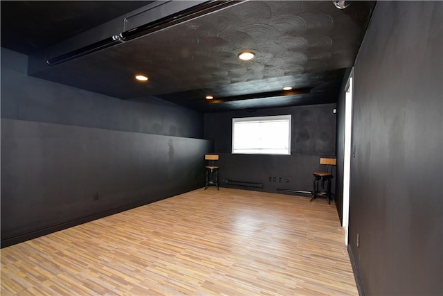 1 Augusta St, Providence, RI 02908 - unfurnished room featuring a baseboard heating unit and wood finished floors