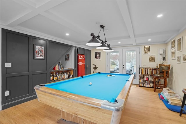 playroom featuring coffered ceiling, recessed lighting, french doors, and light wood-style floors