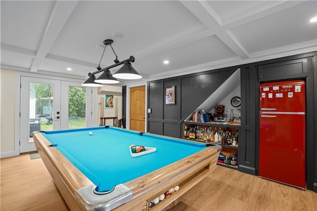 playroom with beam ceiling, light wood-style flooring, french doors, and coffered ceiling