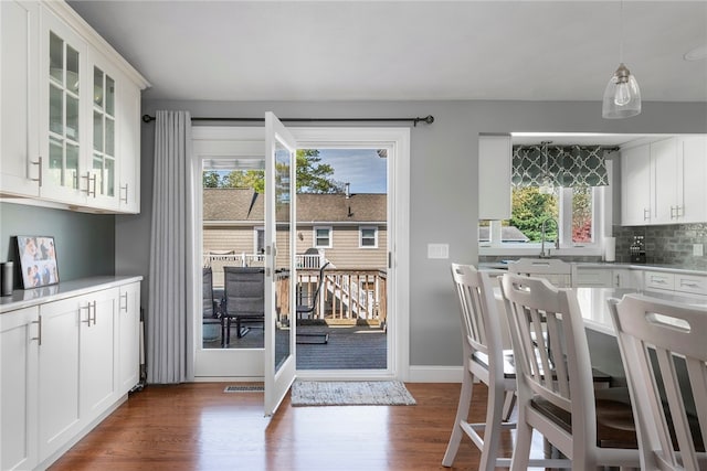 136 Wilde Field Dr, Warwick, RI 02889 - doorway to outside featuring baseboards, a sink, dark wood finished floors, and visible vents