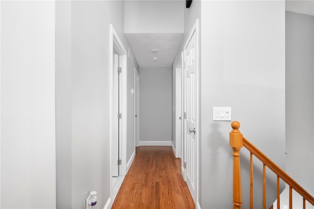 136 Wilde Field Dr, Warwick, RI 02889 - hallway featuring baseboards, wood finished floors, and an upstairs landing