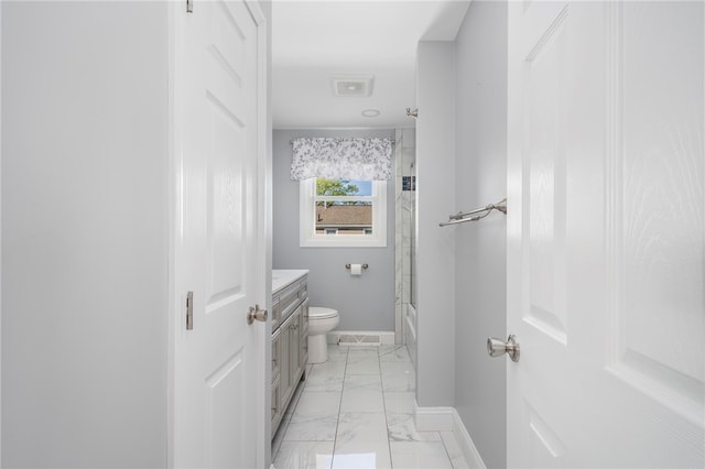 136 Wilde Field Dr, Warwick, RI 02889 - full bathroom featuring vanity, toilet, marble finish floor, baseboards, and shower / bath combination