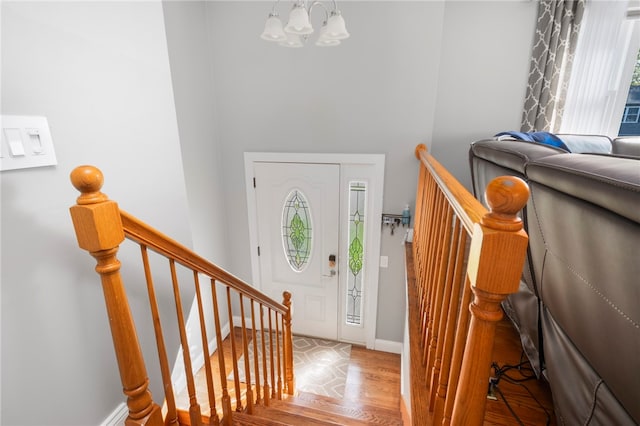 136 Wilde Field Dr, Warwick, RI 02889 - entryway with baseboards, an inviting chandelier, and wood finished floors