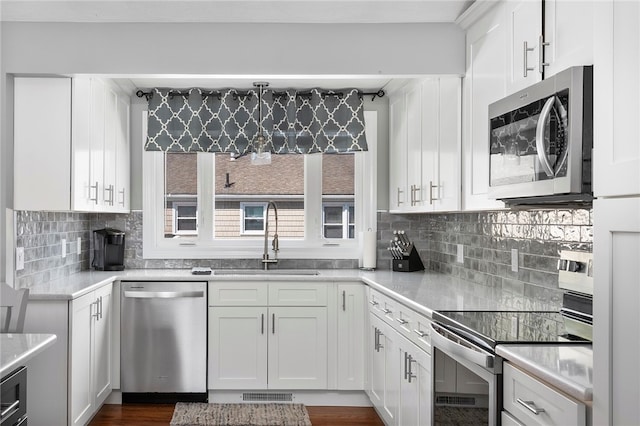 136 Wilde Field Dr, Warwick, RI 02889 - kitchen featuring visible vents, light countertops, white cabinets, a sink, and stainless steel appliances
