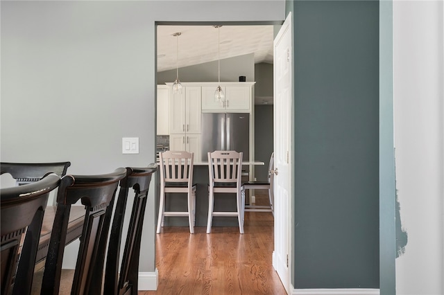 136 Wilde Field Dr, Warwick, RI 02889 - dining area with vaulted ceiling and wood finished floors