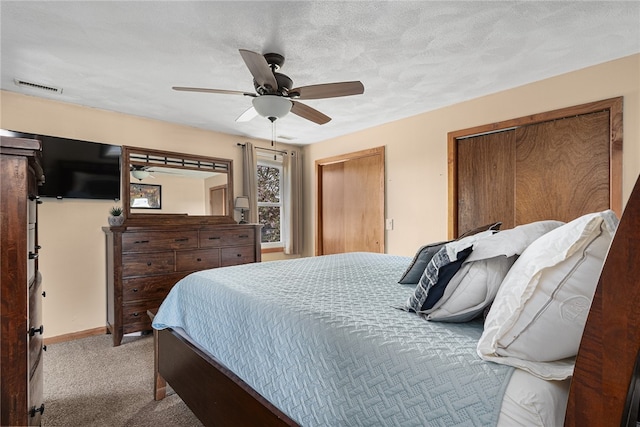 136 Wilde Field Dr, Warwick, RI 02889 - bedroom featuring carpet flooring, ceiling fan, multiple closets, baseboards, and visible vents