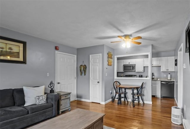 200 Manville Hill Rd Unit 126, Cumberland, RI 02864 - living area featuring baseboards, a ceiling fan, and wood finished floors