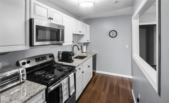 200 Manville Hill Rd Unit 126, Cumberland, RI 02864 - kitchen featuring a sink, light stone countertops, stainless steel appliances, and white cabinetry