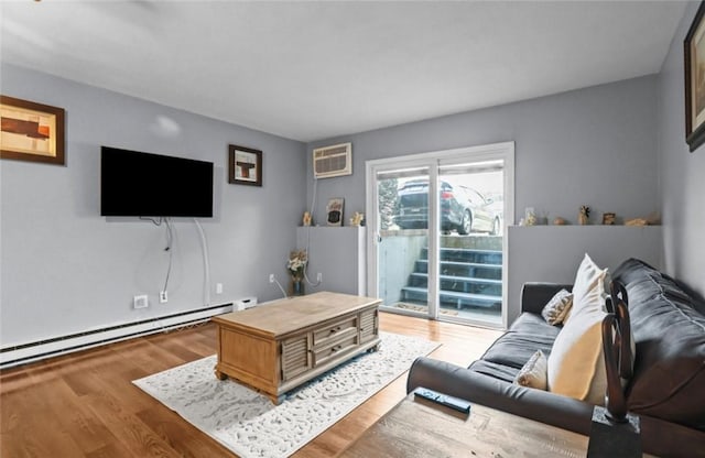 200 Manville Hill Rd Unit 126, Cumberland, RI 02864 - living area featuring a baseboard heating unit, wood finished floors, and an AC wall unit