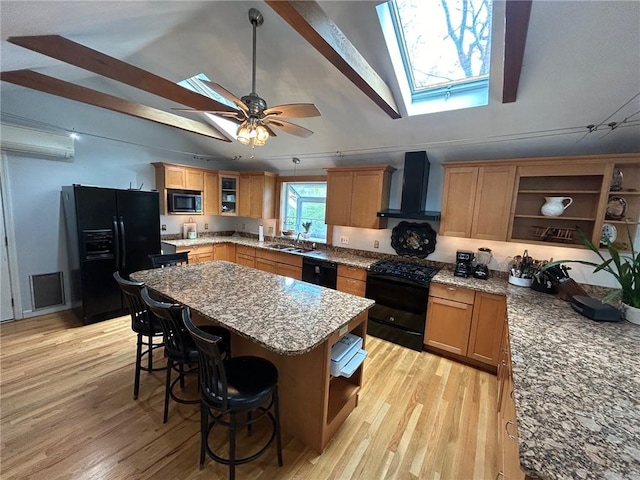 63 Duck Cove Rd, North Kingstown, RI 02852 - kitchen with wall chimney range hood, light stone counters, open shelves, and black appliances