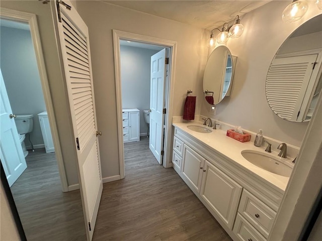 63 Duck Cove Rd, North Kingstown, RI 02852 - full bath featuring toilet, a sink, and wood finished floors