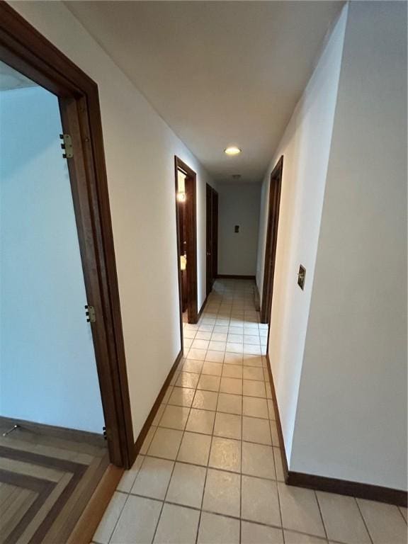 63 Duck Cove Rd, North Kingstown, RI 02852 - hallway featuring baseboards and light tile patterned floors