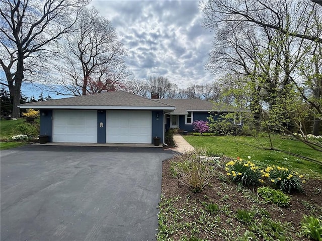 63 Duck Cove Rd, North Kingstown, RI 02852 - single story home featuring a garage, a front lawn, driveway, and a chimney