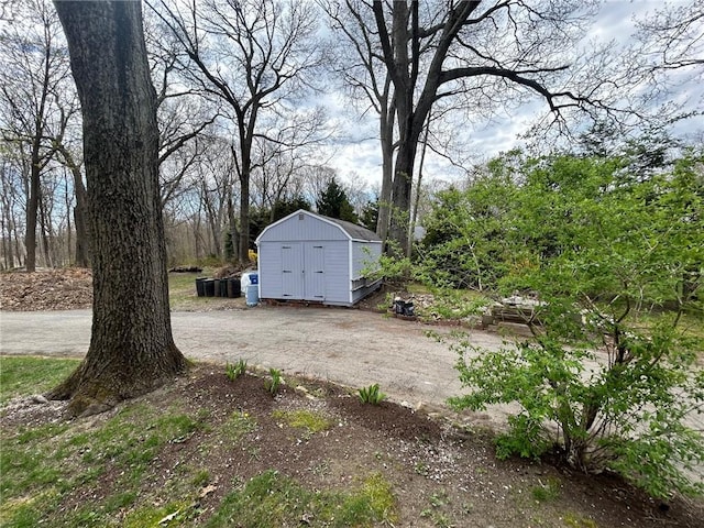 63 Duck Cove Rd, North Kingstown, RI 02852 - view of yard featuring an outbuilding, a shed, and dirt driveway