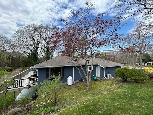 63 Duck Cove Rd, North Kingstown, RI 02852 - rear view of property with a yard, a wooden deck, and roof with shingles