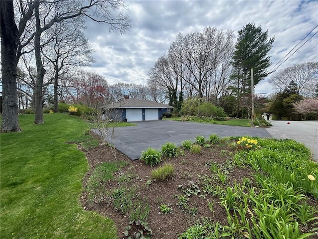 63 Duck Cove Rd, North Kingstown, RI 02852 - view of yard featuring a garage