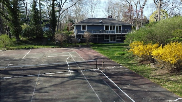 63 Duck Cove Rd, North Kingstown, RI 02852 - exterior space with a yard, a deck, community basketball court, and a chimney