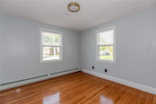 46 Freeman St, Warwick, RI 02886 - unfurnished room featuring baseboards, a baseboard radiator, and light wood finished floors