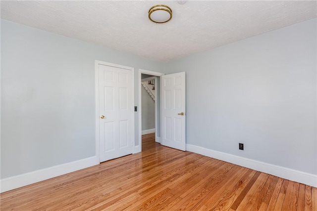 46 Freeman St, Warwick, RI 02886 - interior space with baseboards, a textured ceiling, and light wood-style flooring