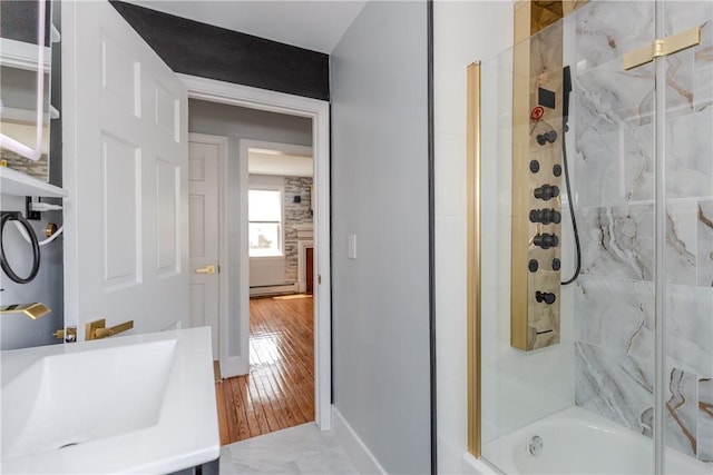 46 Freeman St, Warwick, RI 02886 - full bath featuring vanity, a baseboard radiator, and shower / bath combination with glass door
