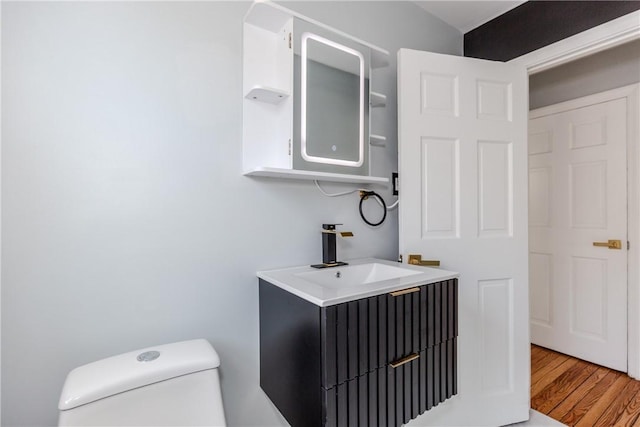 46 Freeman St, Warwick, RI 02886 - bathroom featuring vanity, wood finished floors, and toilet