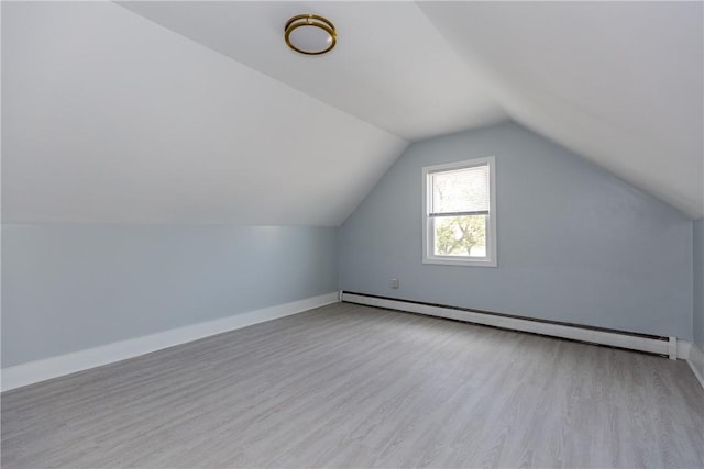 46 Freeman St, Warwick, RI 02886 - bonus room with baseboards, a baseboard heating unit, wood finished floors, and vaulted ceiling