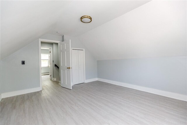 46 Freeman St, Warwick, RI 02886 - bonus room featuring baseboards, light wood finished floors, lofted ceiling, and baseboard heating