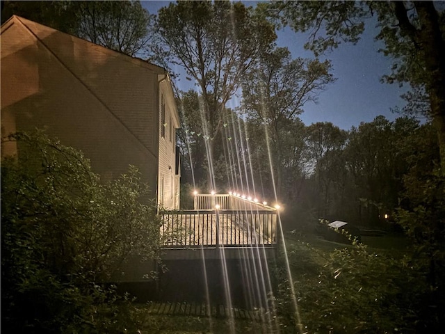 view of home's exterior featuring a deck