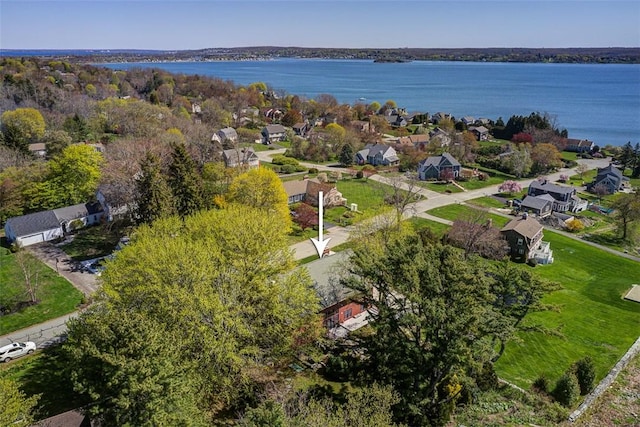 birds eye view of property featuring a water view and a residential view
