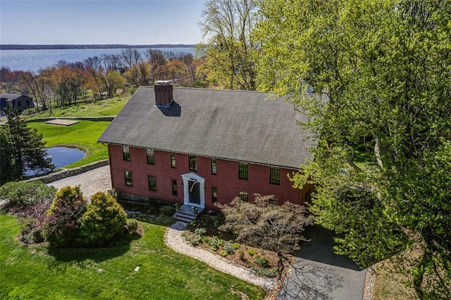 birds eye view of property featuring a water view