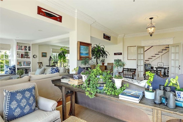 living room with stairway and ornamental molding