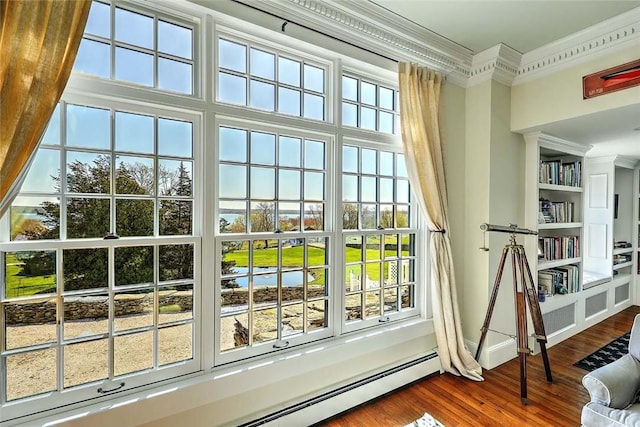 entryway with crown molding, baseboards, baseboard heating, and dark wood-type flooring
