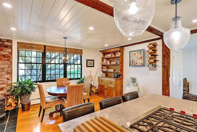 dining space with recessed lighting, wood finished floors, and wooden ceiling