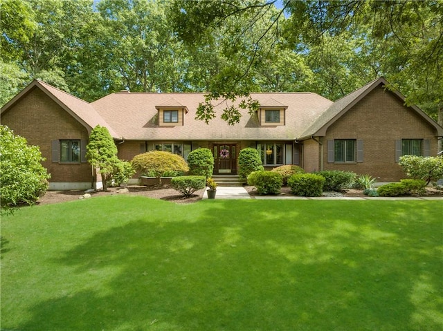 10 Oak Hill Dr, Lincoln, RI 02865 - ranch-style house with a front yard, a shingled roof, and brick siding