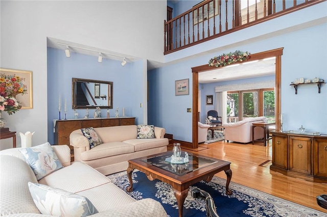 10 Oak Hill Dr, Lincoln, RI 02865 - living area with rail lighting and light wood-style flooring