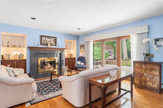 10 Oak Hill Dr, Lincoln, RI 02865 - living area featuring wood finished floors, a premium fireplace, and recessed lighting