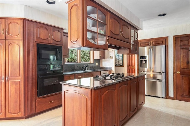 10 Oak Hill Dr, Lincoln, RI 02865 - kitchen featuring a sink, decorative backsplash, glass insert cabinets, a center island, and black appliances