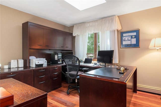 10 Oak Hill Dr, Lincoln, RI 02865 - office space with a baseboard heating unit, a skylight, and light wood-style floors