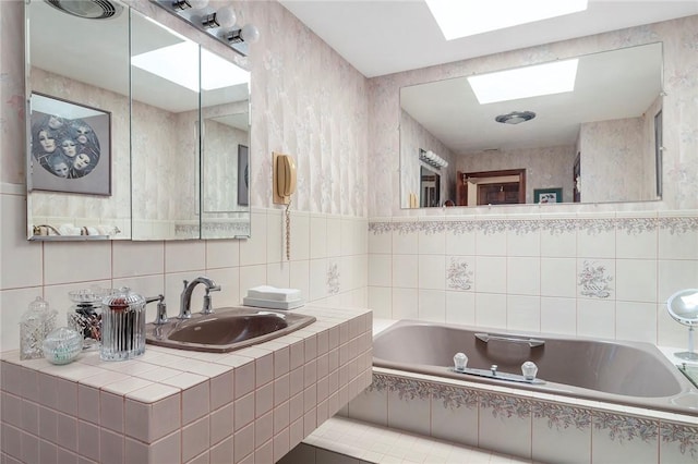 10 Oak Hill Dr, Lincoln, RI 02865 - bathroom featuring a garden tub, a skylight, and a sink