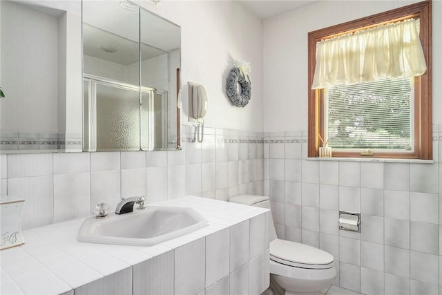 10 Oak Hill Dr, Lincoln, RI 02865 - bathroom with toilet, a stall shower, tile walls, and a sink