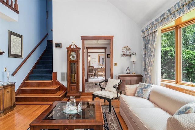 10 Oak Hill Dr, Lincoln, RI 02865 - living area featuring visible vents, stairs, lofted ceiling, and light wood-style flooring