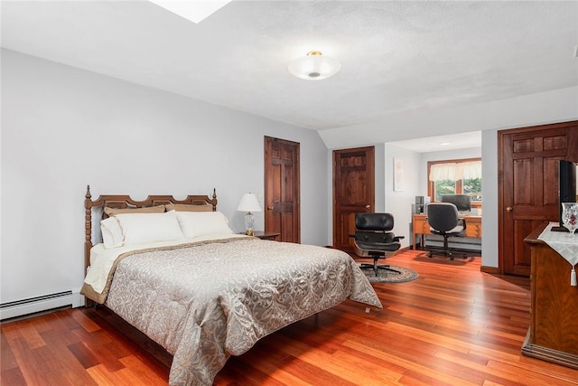 10 Oak Hill Dr, Lincoln, RI 02865 - bedroom featuring a baseboard heating unit, baseboard heating, and wood finished floors