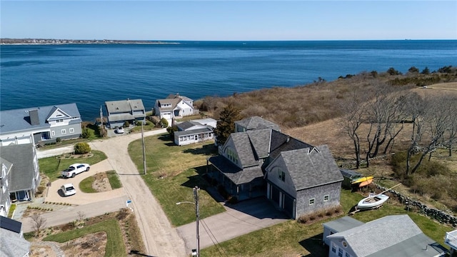 birds eye view of property featuring a residential view and a water view