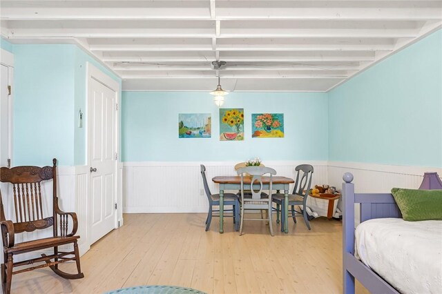 dining room featuring light wood-style floors and wainscoting