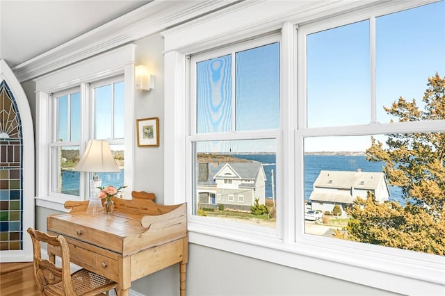 interior space featuring a water view and a healthy amount of sunlight